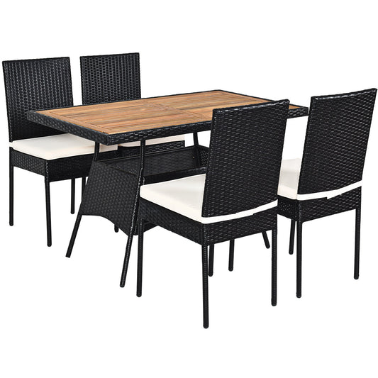 Outdoor wicker dining set includes one table and four cushioned chairs for family meals