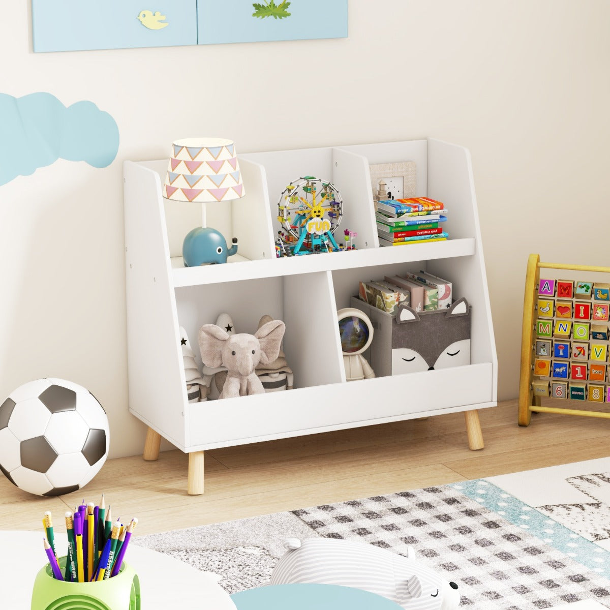 White toy shelf raised 11 cm from the floor to reduce dust and simplify cleaning underneath