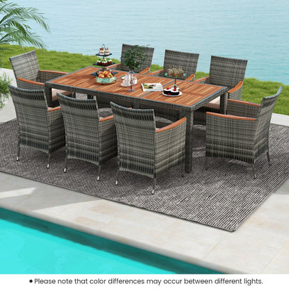 Weather-resistant rattan chairs provide comfortable seating for backyard dining occasions