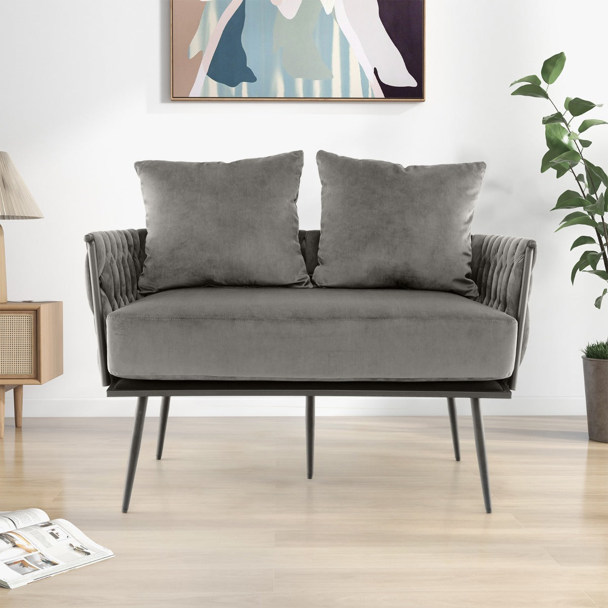 Woven back and armrests provide decorative texture and ergonomic support for lounging
