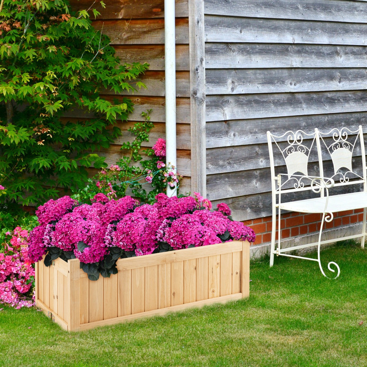 Spacious planting bed accommodates vegetables, herbs, flowers, and other garden plants