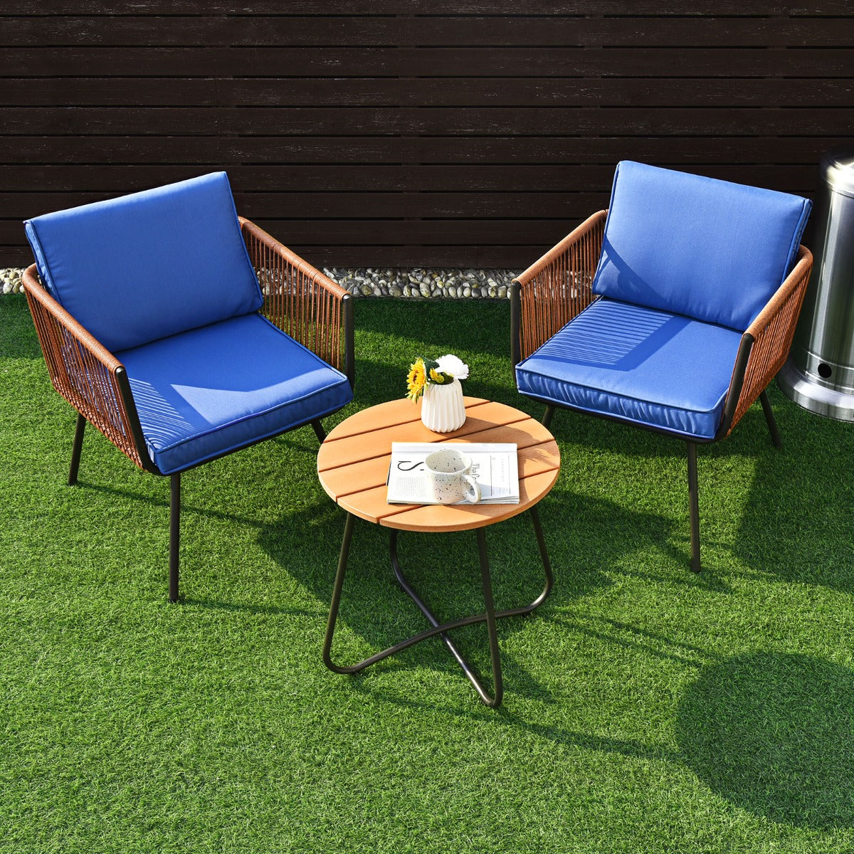 Round steel coffee table provides space for books, snacks, drinks, and other outdoor essentials