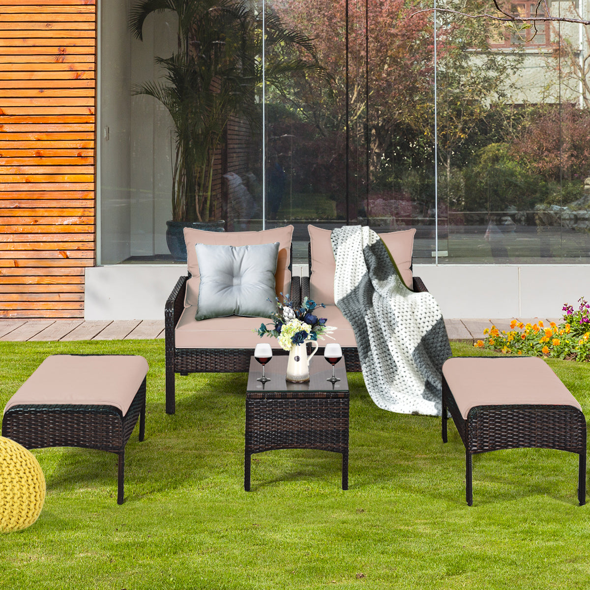 Hand-woven brown rattan furniture adds timeless style to patios, porches, gardens, and balconies