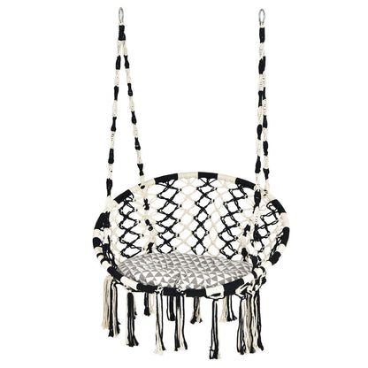 Bohemian hanging chair creates a cozy indoor or outdoor retreat for reading, relaxing, and napping