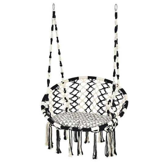 Bohemian hanging chair creates a cozy indoor or outdoor retreat for reading, relaxing, and napping
