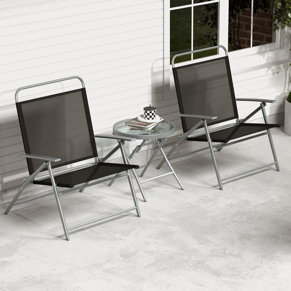 Folding patio chairs and coffee table store easily under beds or in corners when not in use
