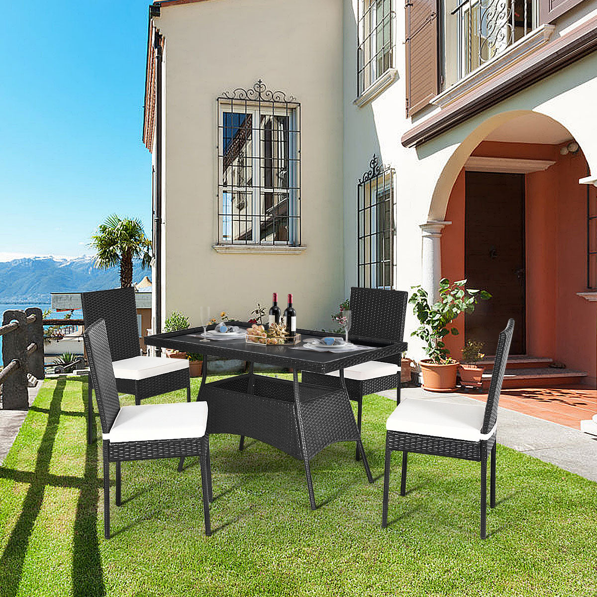 Four cushioned chairs and a spacious table provide an inviting setting for family gatherings