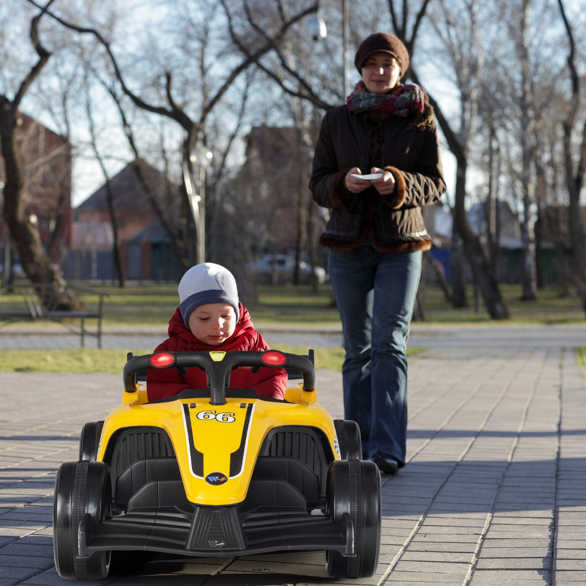 Red or yellow electric ride-on racing truck with safety belt and power indicator for confident driving