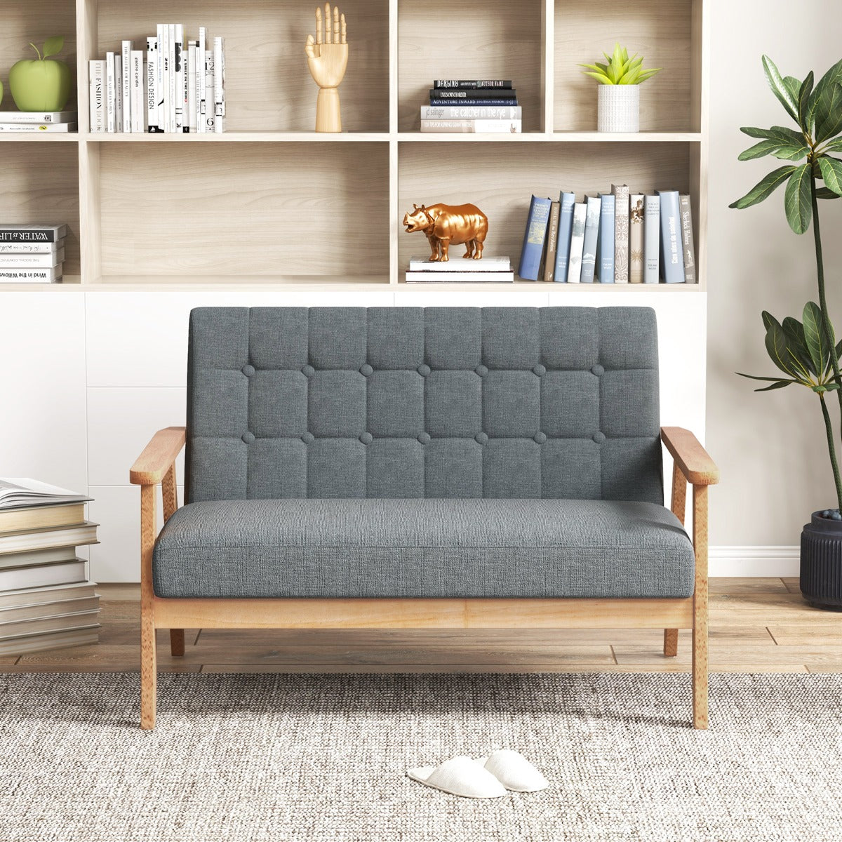 Mid-century loveseat sofa with wide backrest, padded seat, natural wood legs, and supportive armrests